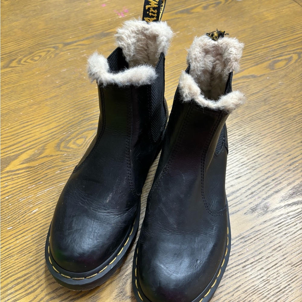 Dr. Martens size 8. One tab is ripped off left boot